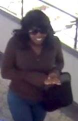 Female suspect wearing sunglasses